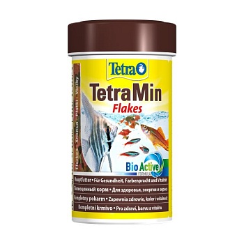 фото корм для акваріумних тропічних риб tetra min flakes в пластівцях, 100 мл